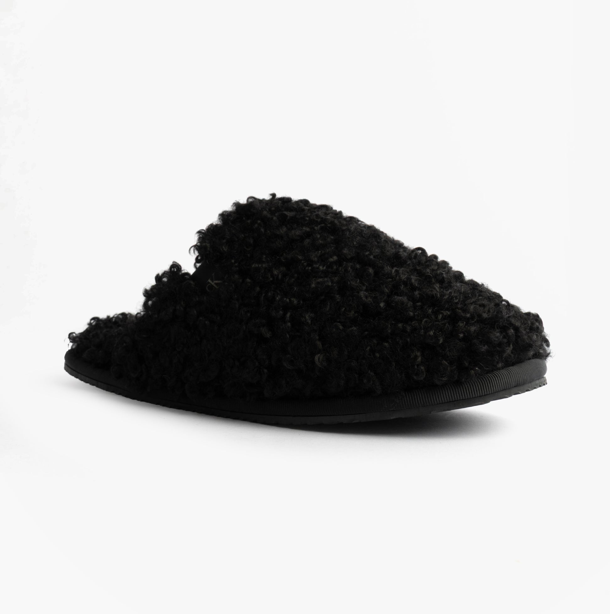 Calvin Klein CLOSE SLIPPER FUR Womens Slippers Black side view showing faux fur upper and flat sole.