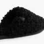 Calvin Klein CLOSE SLIPPER FUR Womens Slippers Black side view showcasing faux fur upper and slip-on design.