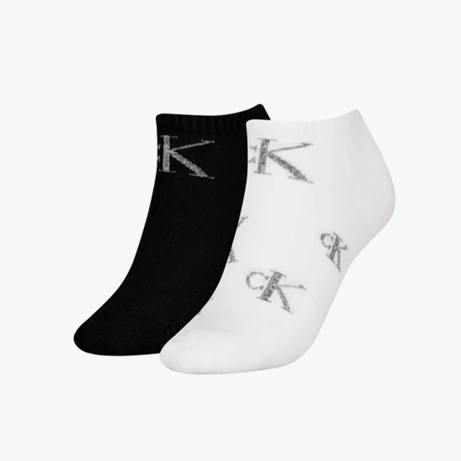 Calvin Klein 2 Pack Trainer Womens Ankle Socks White/Black side view showing one black and one white sock with logo.