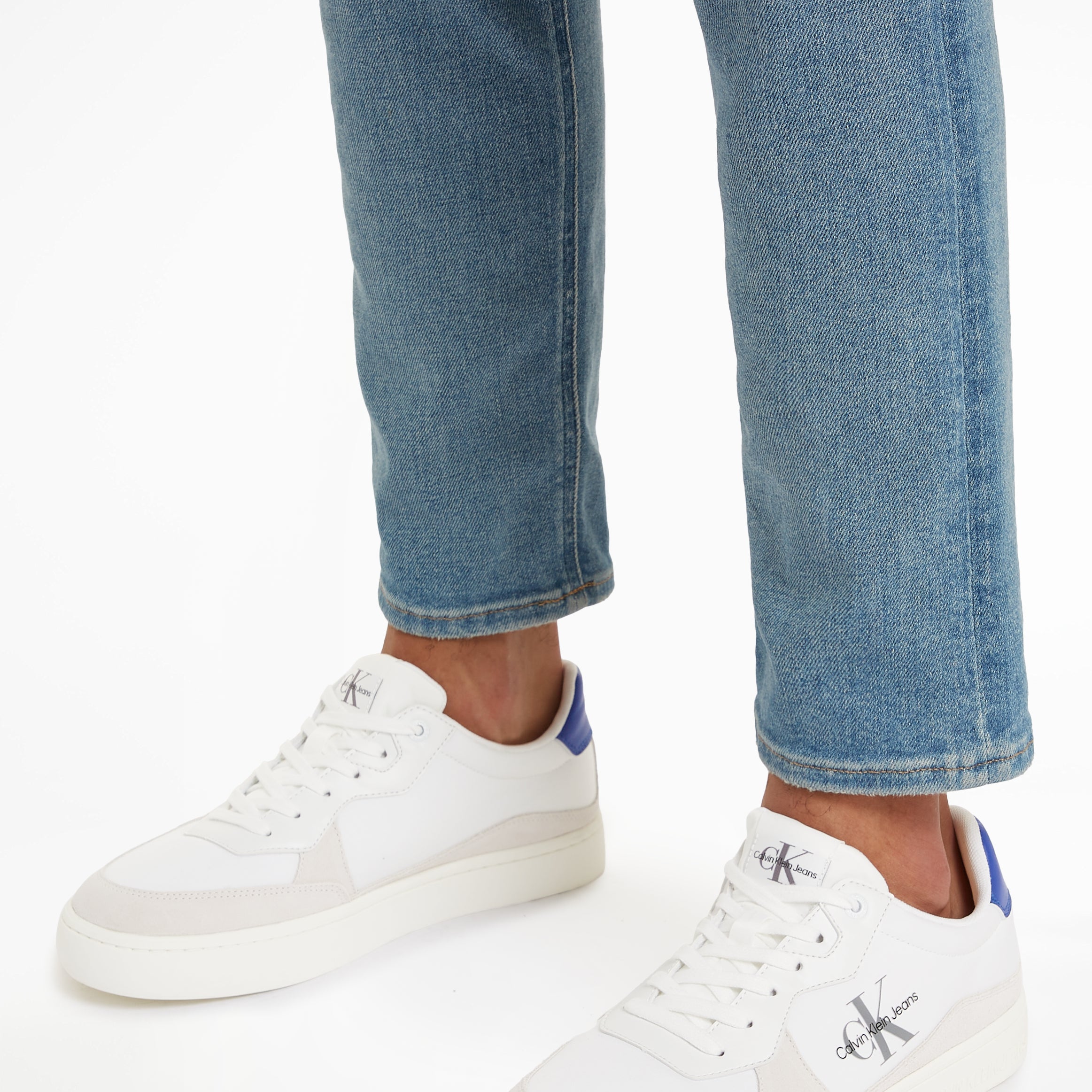 Calvin Klein CLASSIC CUPSOLE Mens Trainers Bright White/Sapphire Blue side view on foot, showcasing casual style and design.