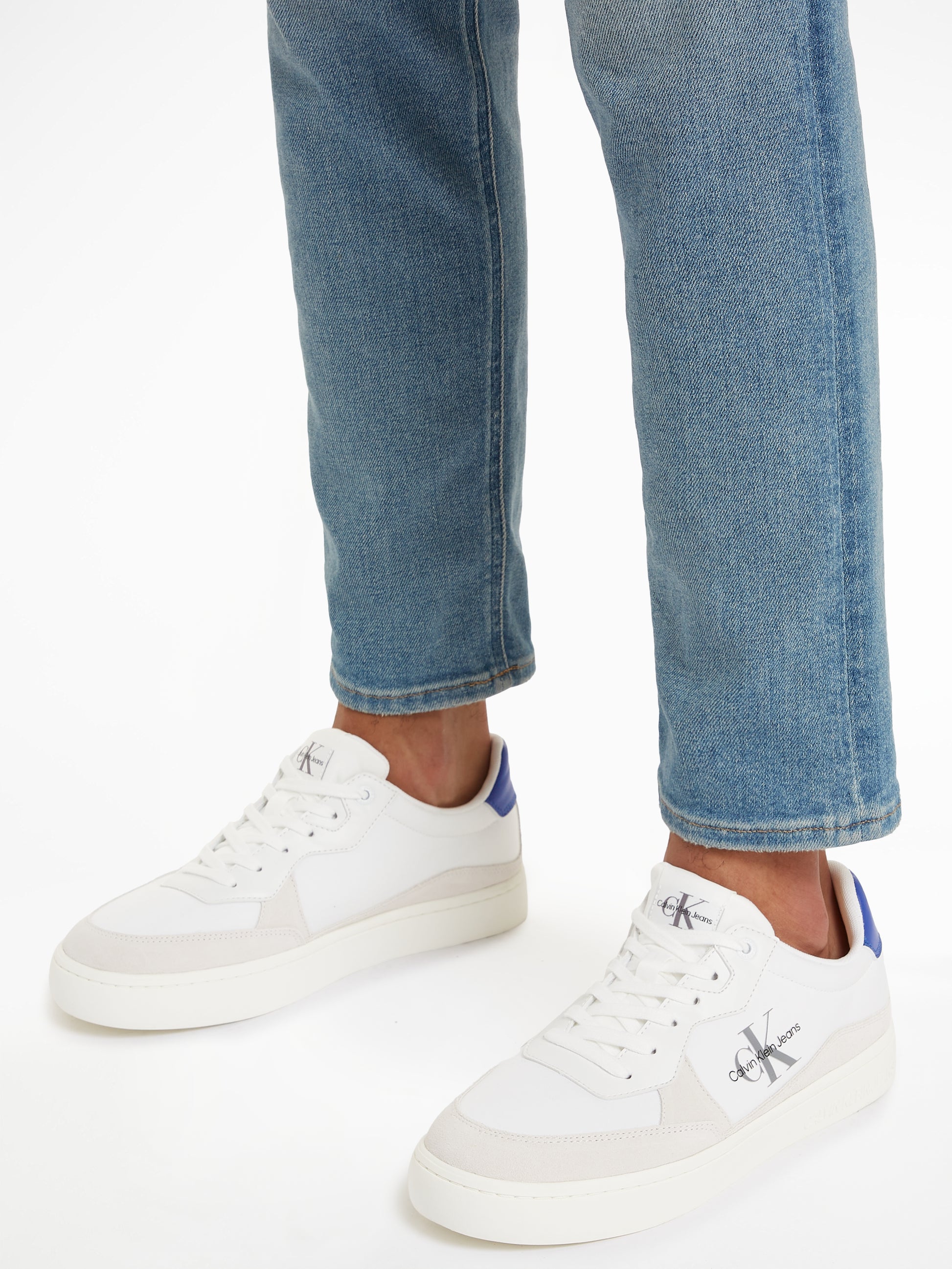 Calvin Klein CLASSIC CUPSOLE Mens Trainers Bright White/Sapphire Blue side view on foot, showcasing casual style and design.