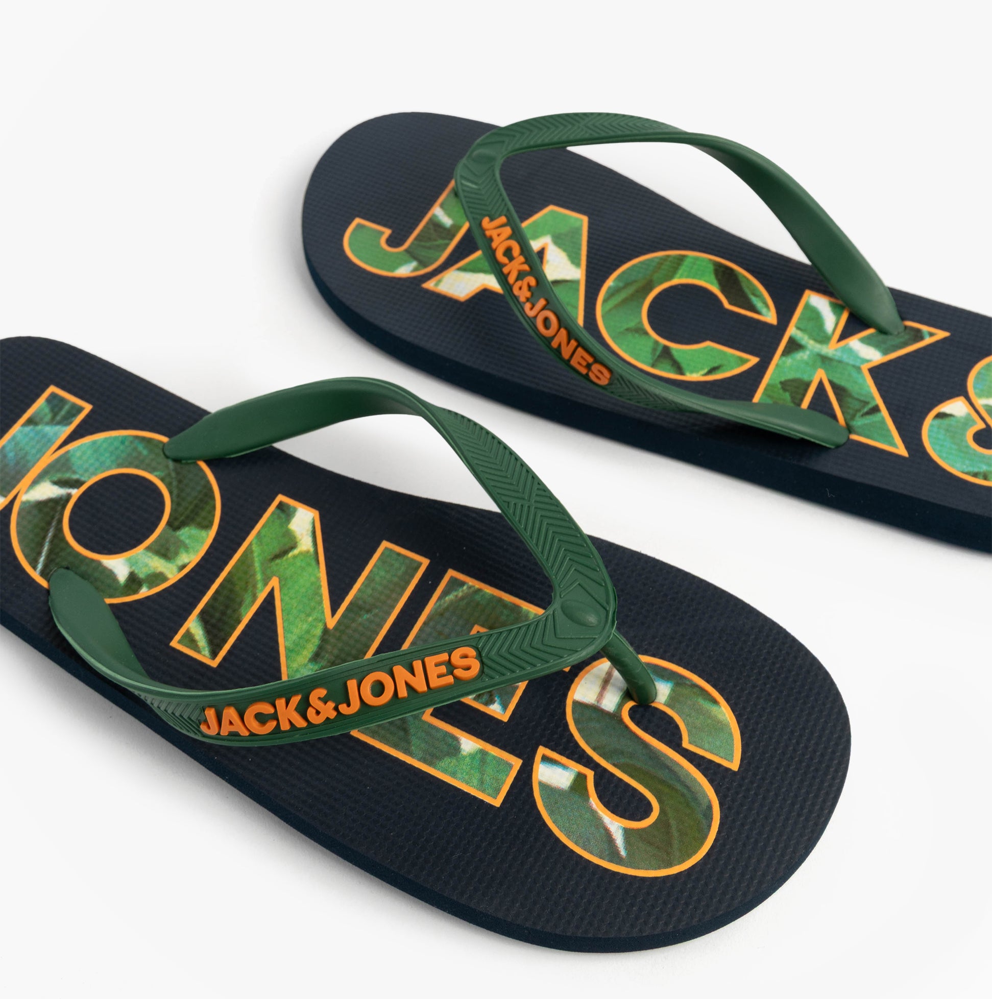 Jack & Jones LOGO PALM PRINT Mens Flip-Flops Navy Blazer top view showcasing green straps and vibrant logo design.