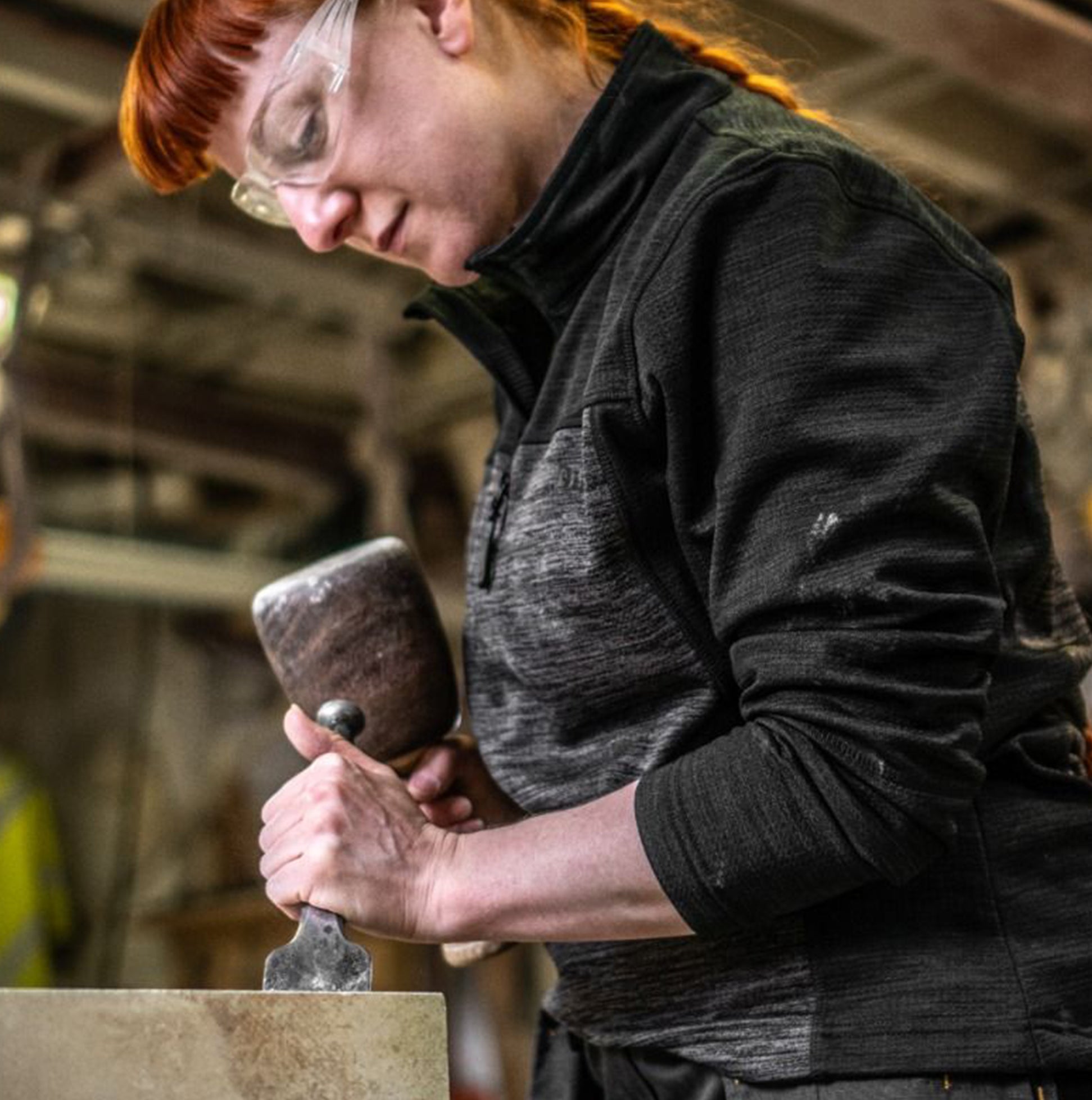 Dewalt CHARLOTTE Womens Sweatshirt Grey Black, front view, model using a chisel in a workshop.
