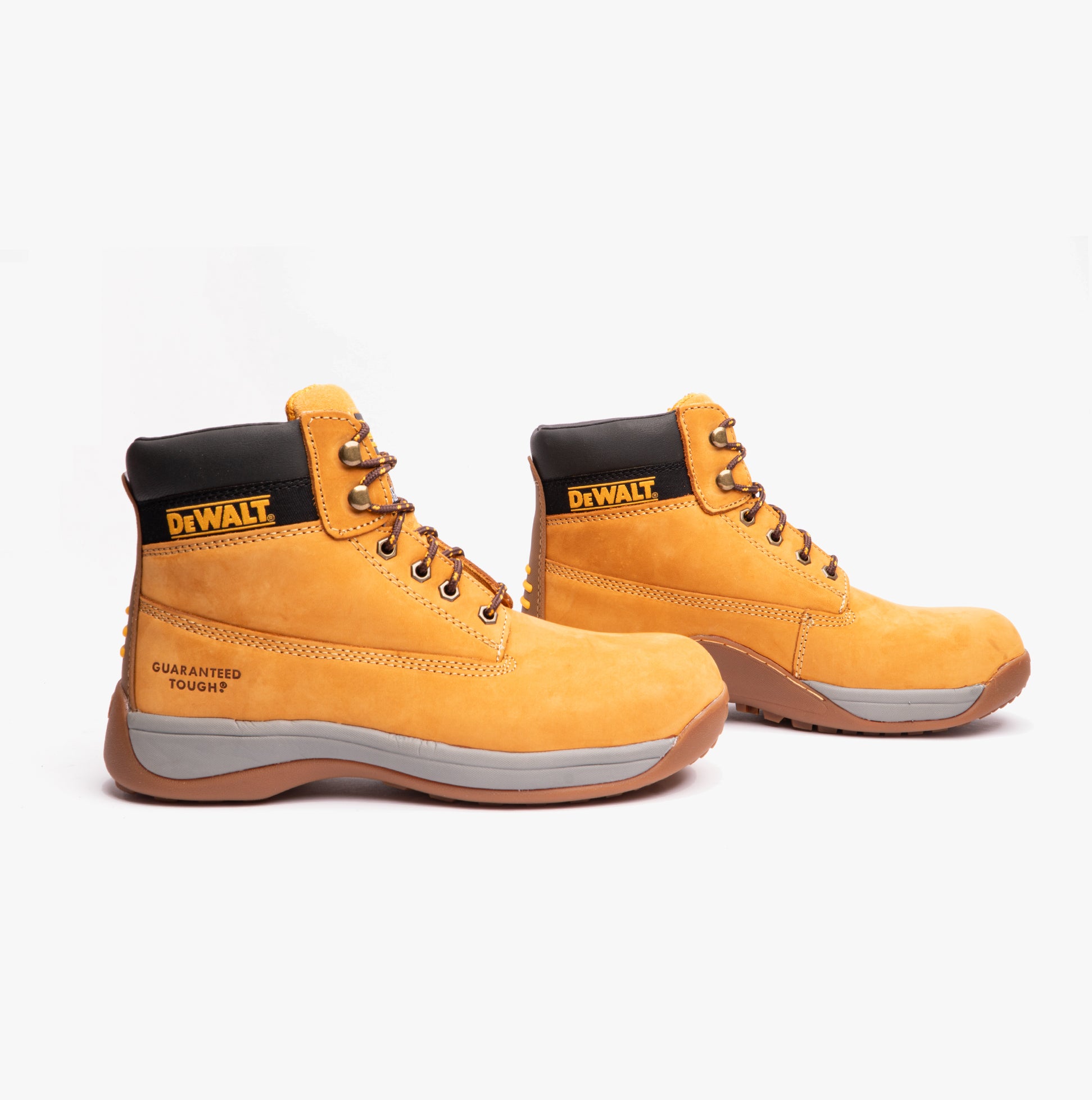 Pair of yellow DeWalt work boots on a white background