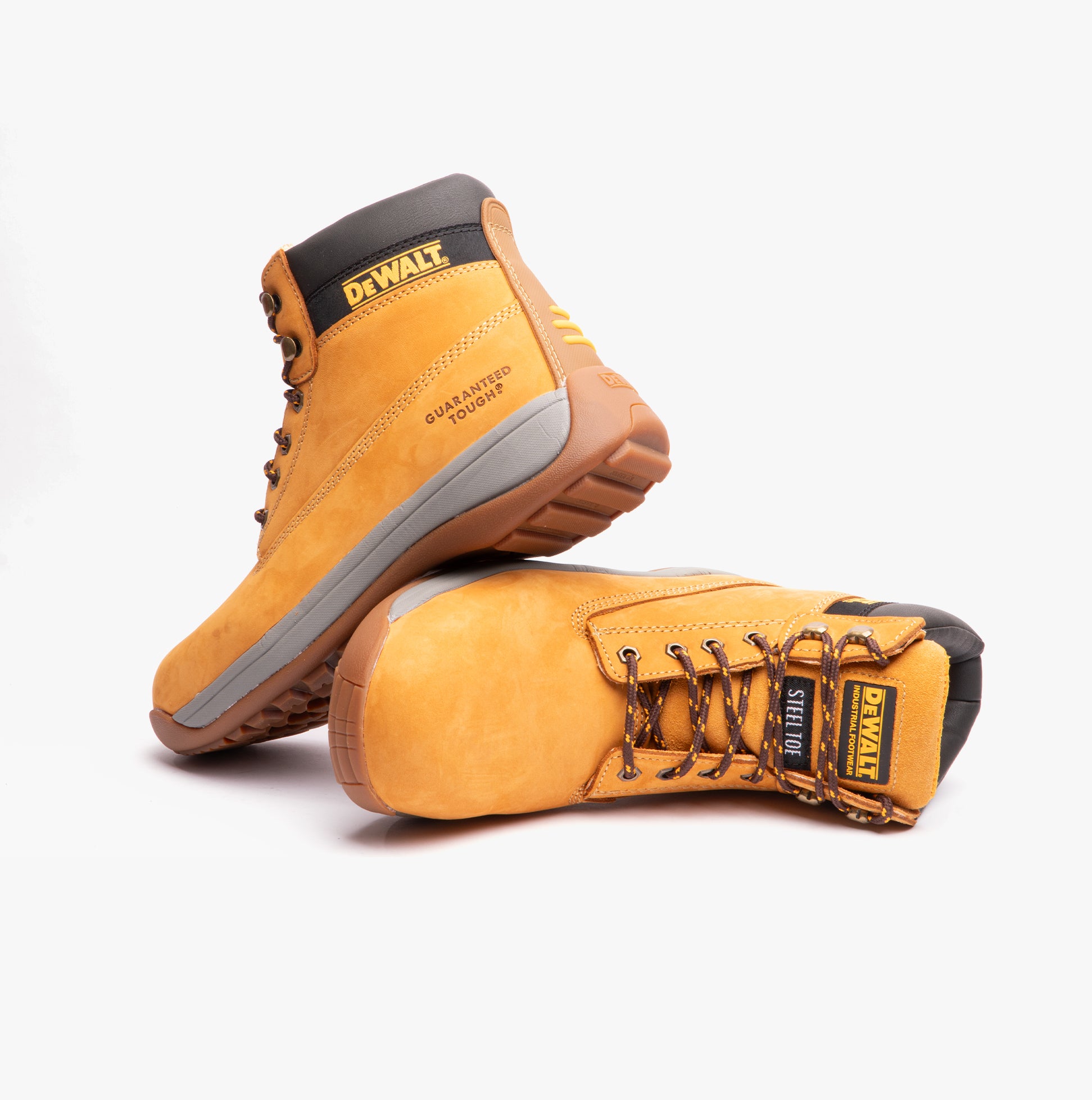 Pair of yellow work boots with black accents on a white background