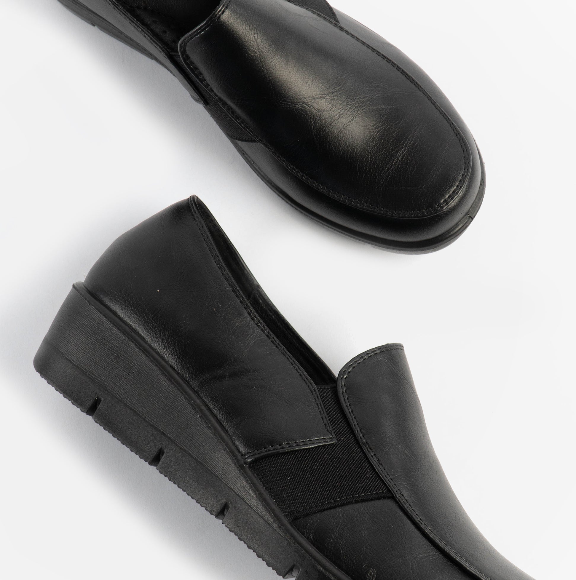 Dr Keller CATHY Womens Shoes Black side view and top view showing slip-on casual design with leather upper and rubber sole.