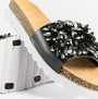 Dr Keller GLITZY Womens Slides Black side view showcasing decorative flower embellishments and lightweight rubber sole.