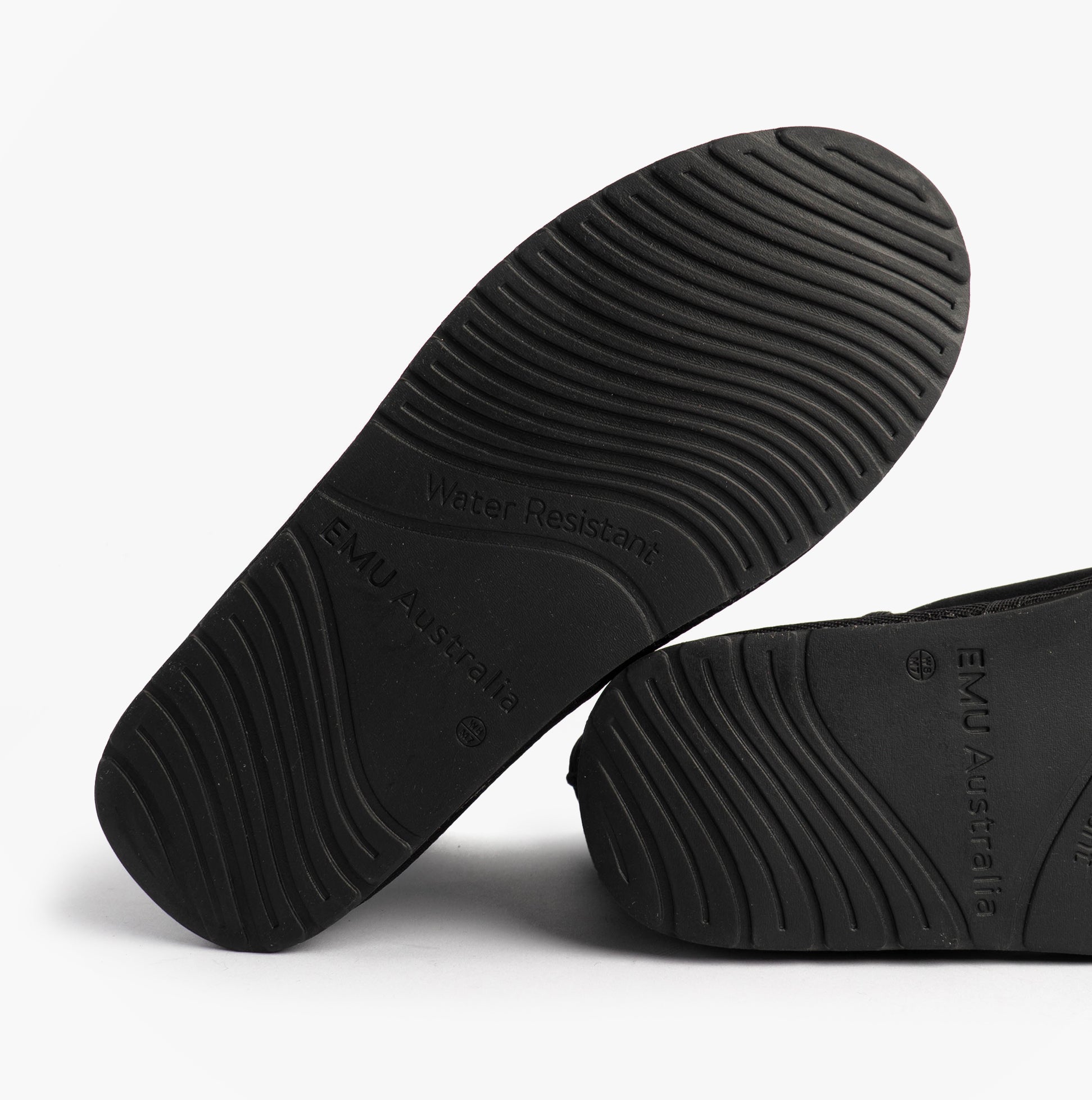 EMU Australia STINGER MINI Womens Sheepskin Boot Black outsole view, featuring rubber sole with water-resistant text.