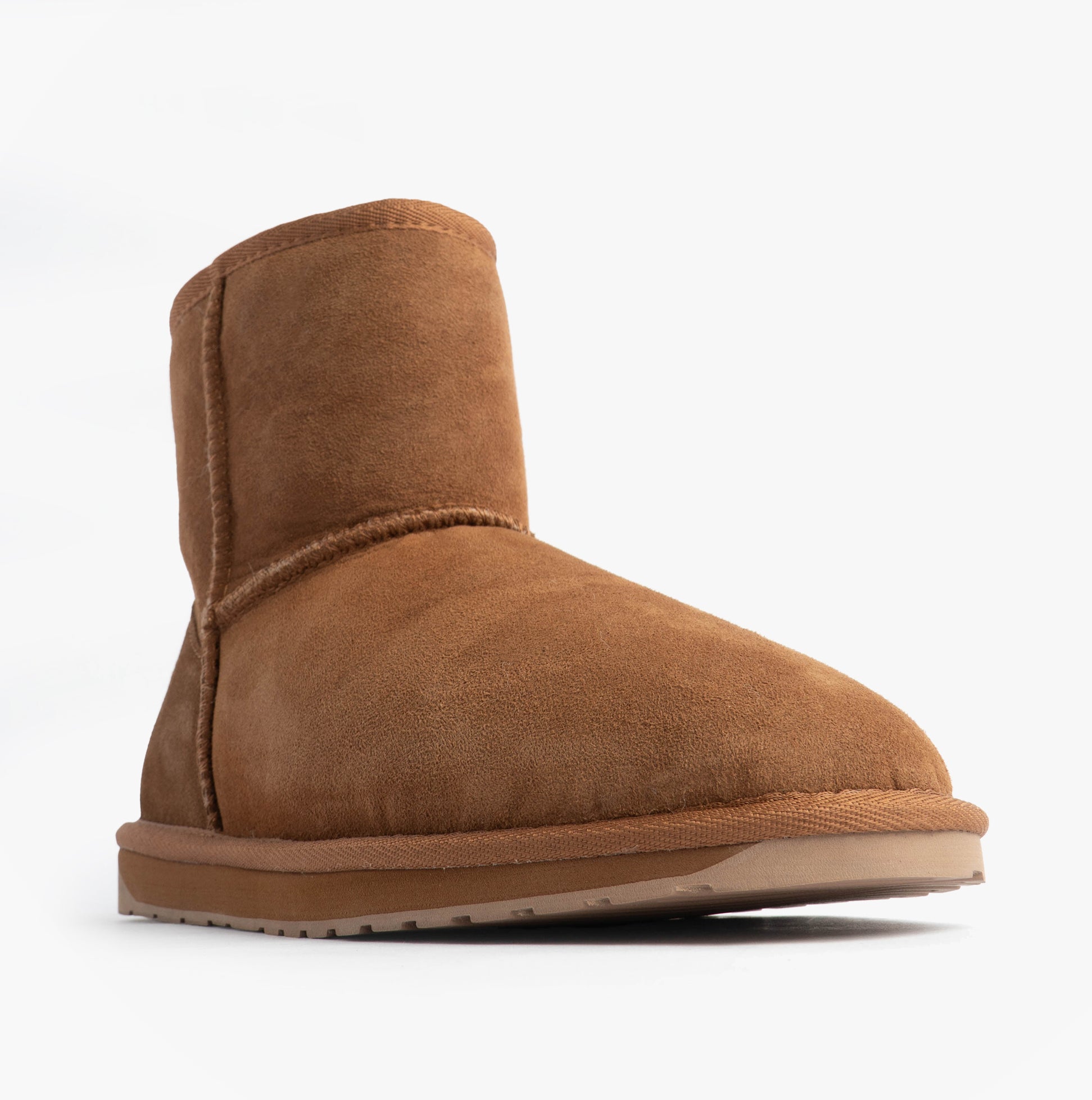 EMU Australia STINGER MINI Womens Sheepskin Boot Chestnut side view showcasing soft sheepskin upper and rubber sole.