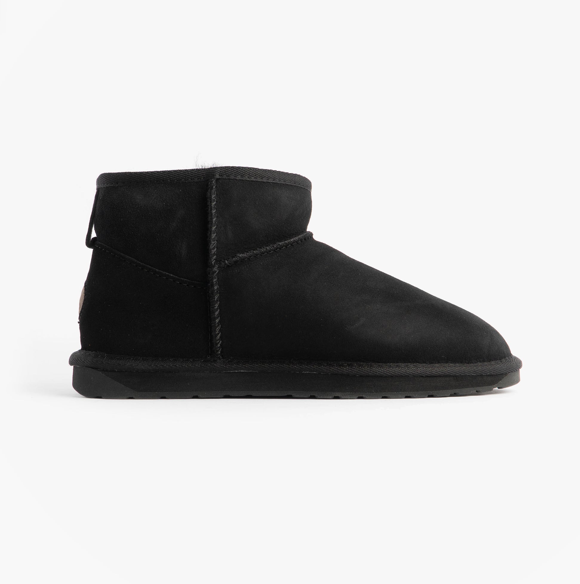 EMU Australia STINGER MICRO Womens Sheepskin Boot Black side view showcasing sheepskin upper and rubber sole.