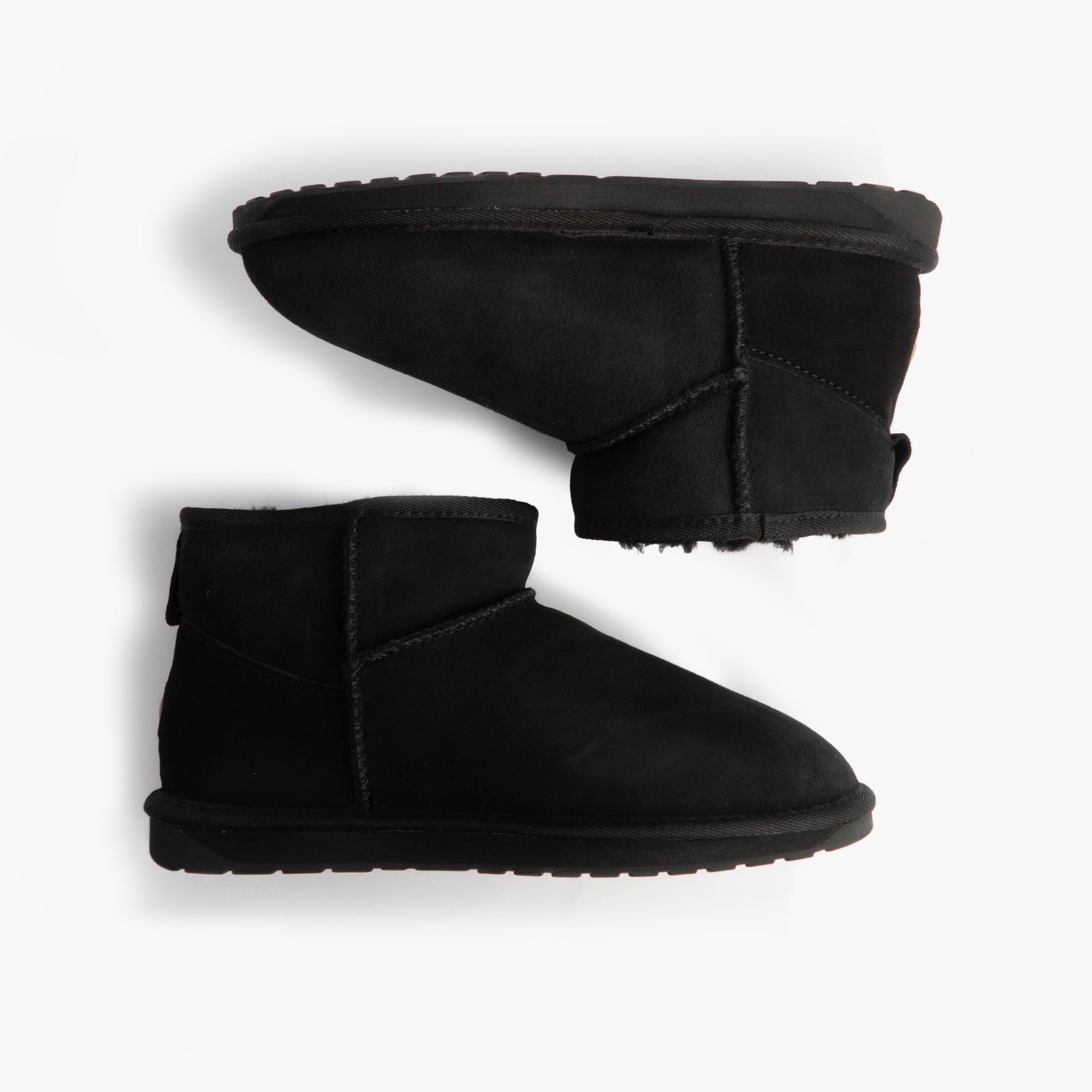 EMU Australia STINGER MICRO Womens Sheepskin Boot Black side view of ankle boots on white background.