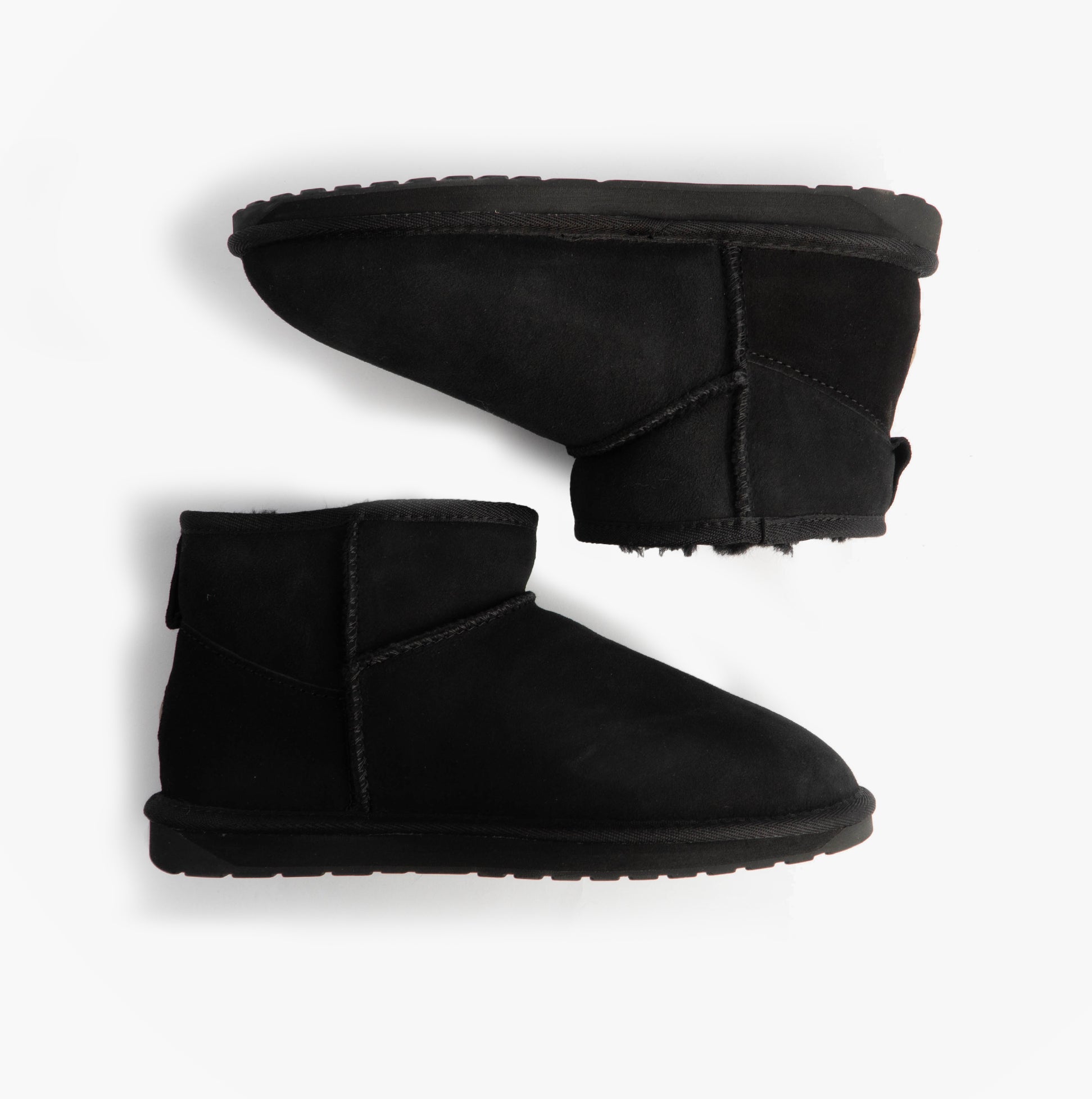 EMU Australia STINGER MICRO Womens Sheepskin Boot Black side view of ankle boots on white background.