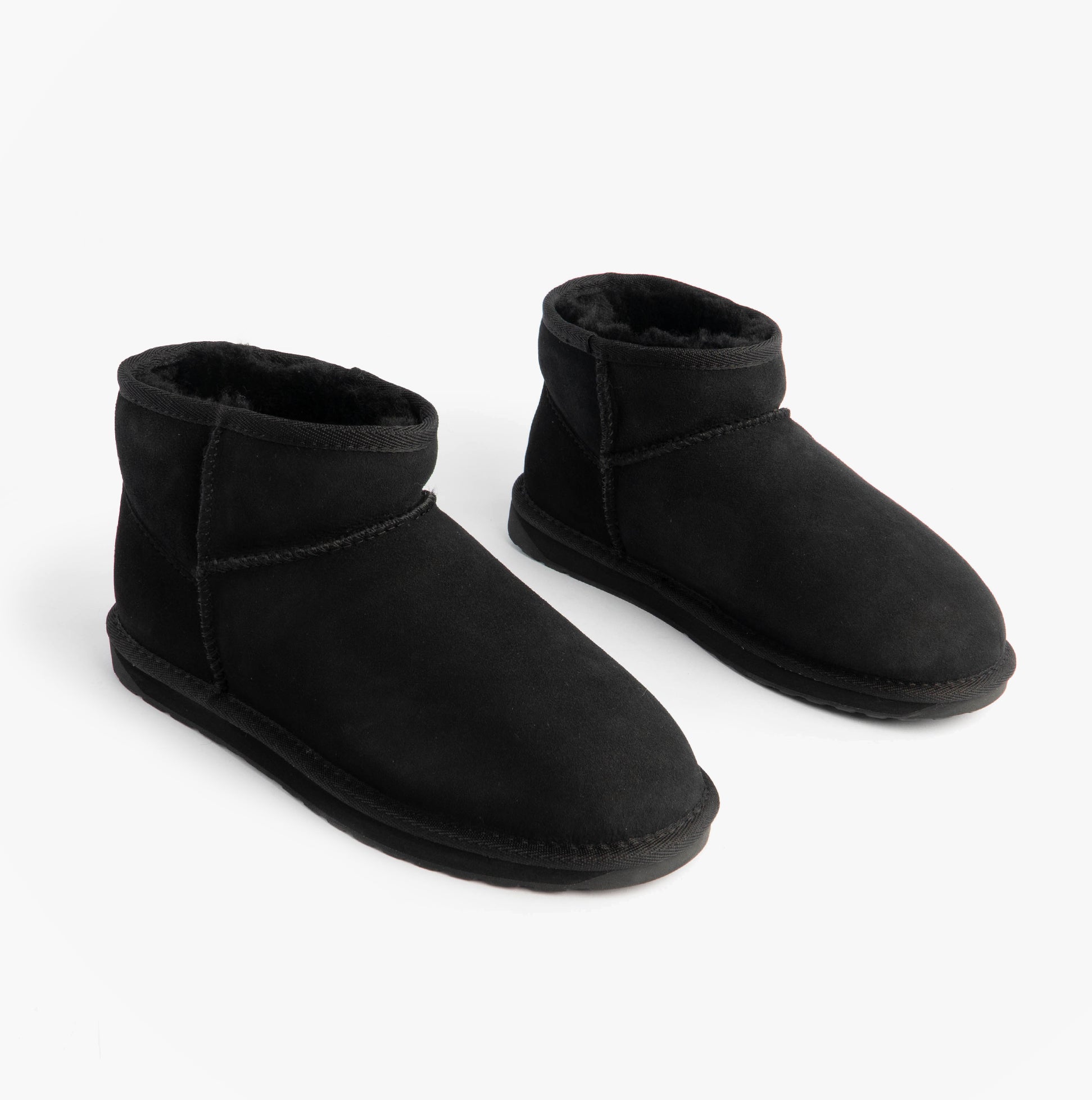 EMU Australia STINGER MICRO Womens Sheepskin Boot Black side view showcasing soft suede upper and ankle height.