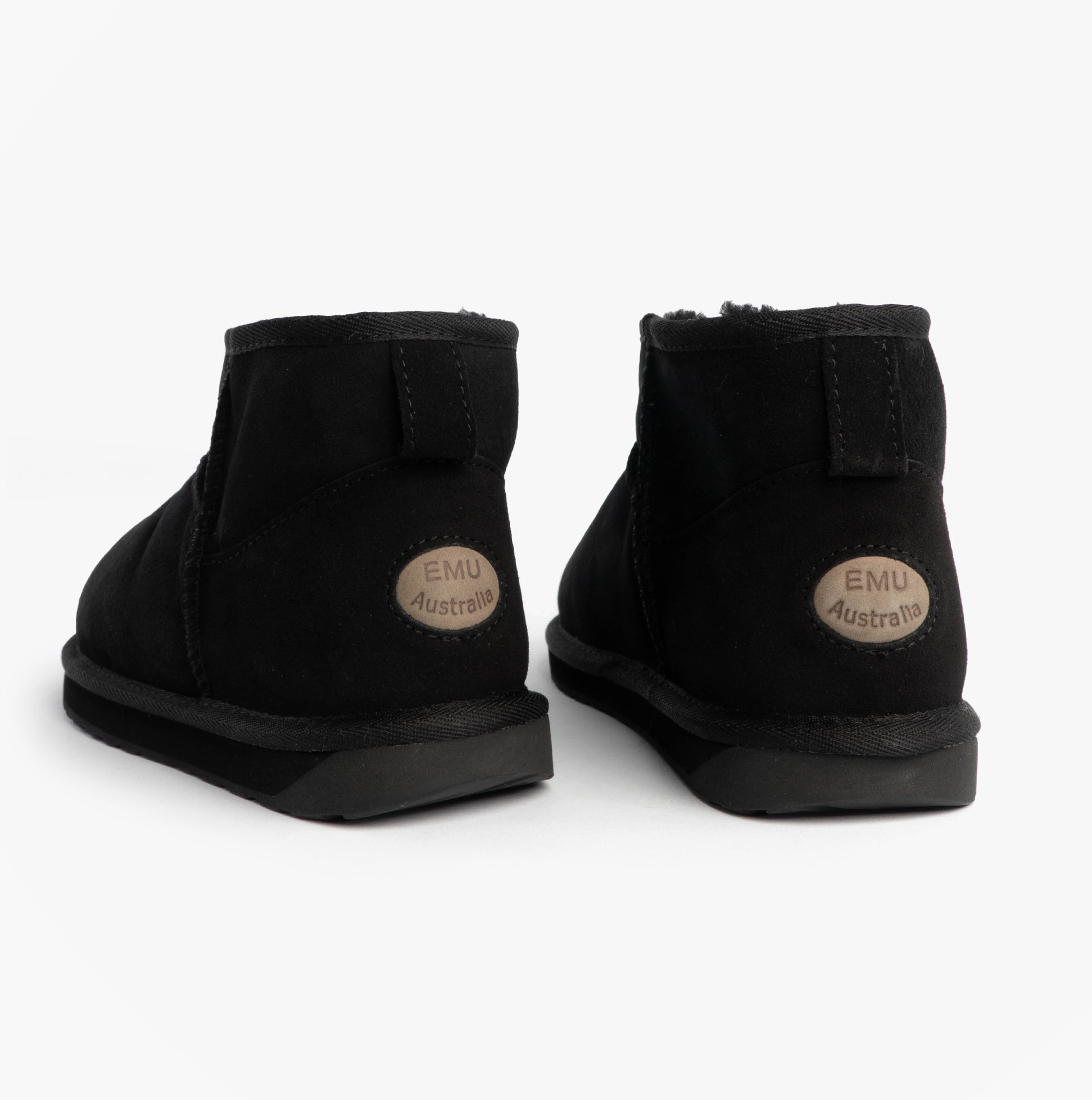 EMU Australia STINGER MICRO Womens Sheepskin Boot Black rear view showing soft sheepskin material and rubber sole.