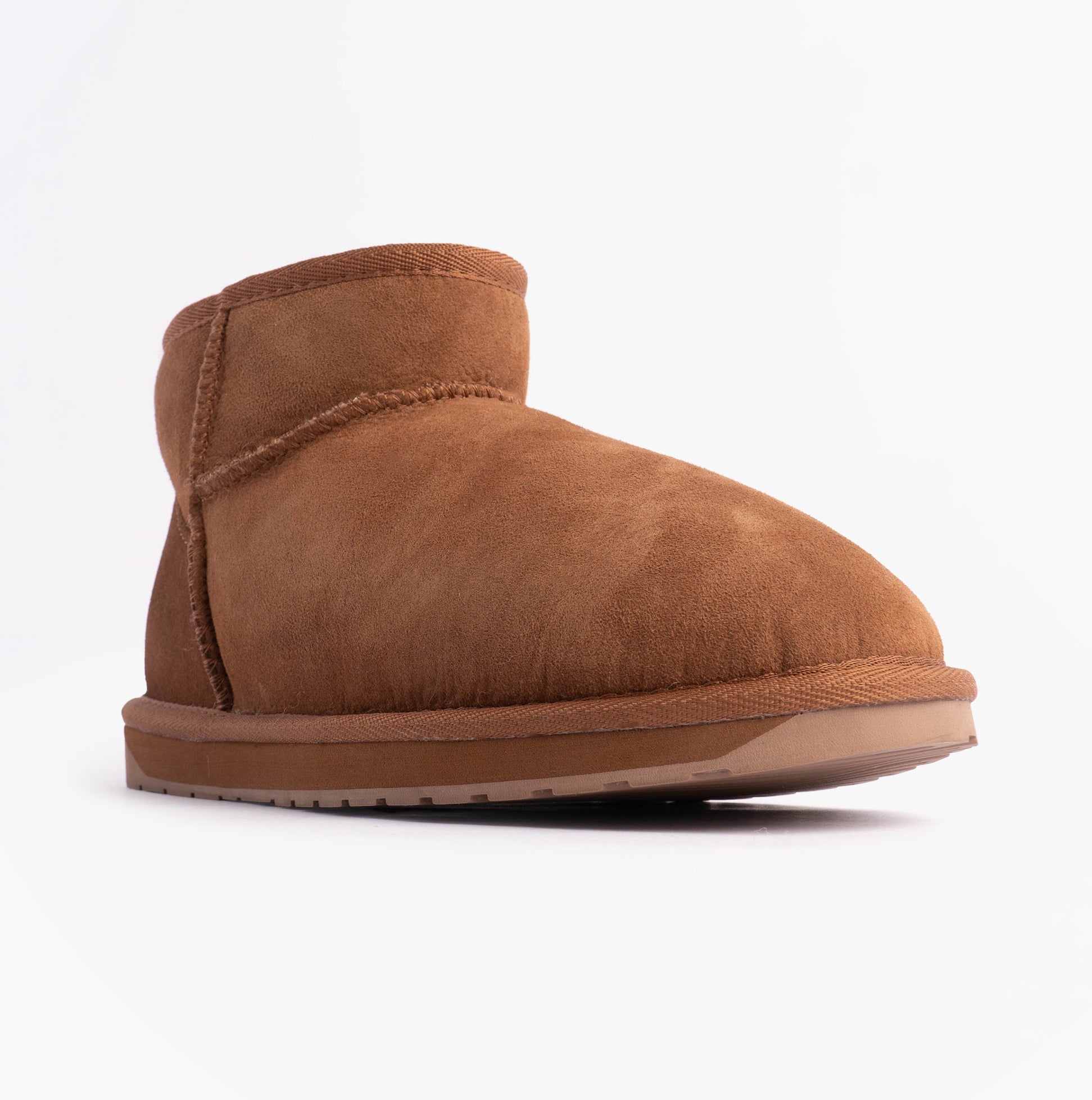 EMU Australia STINGER MICRO Womens Sheepskin Boot Chestnut side view showing soft sheepskin and rubber sole.