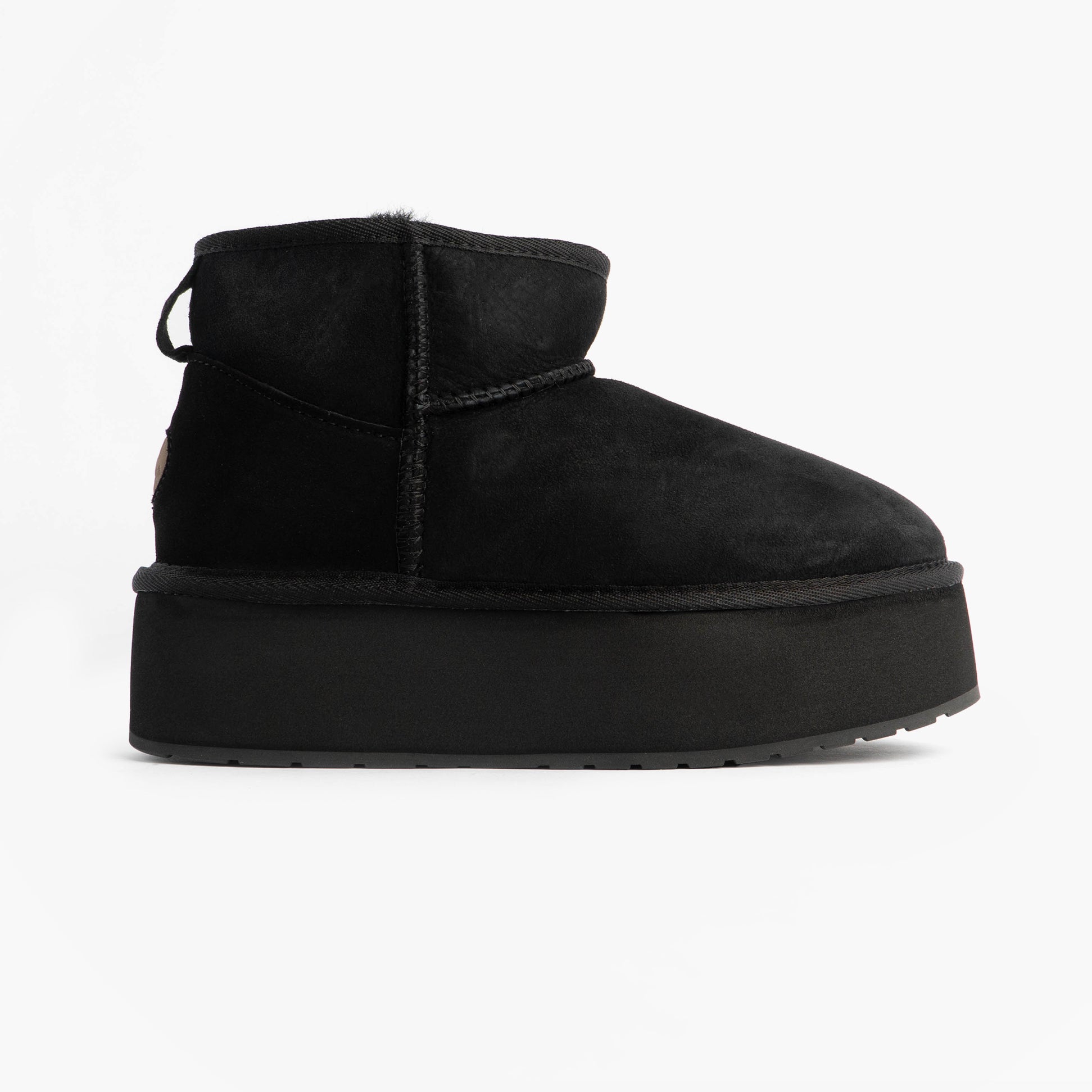 EMU Australia STINGER MICRO FLATFORM Womens Sheepskin Boot Black side view showcasing the shearling upper and mid-calf height.