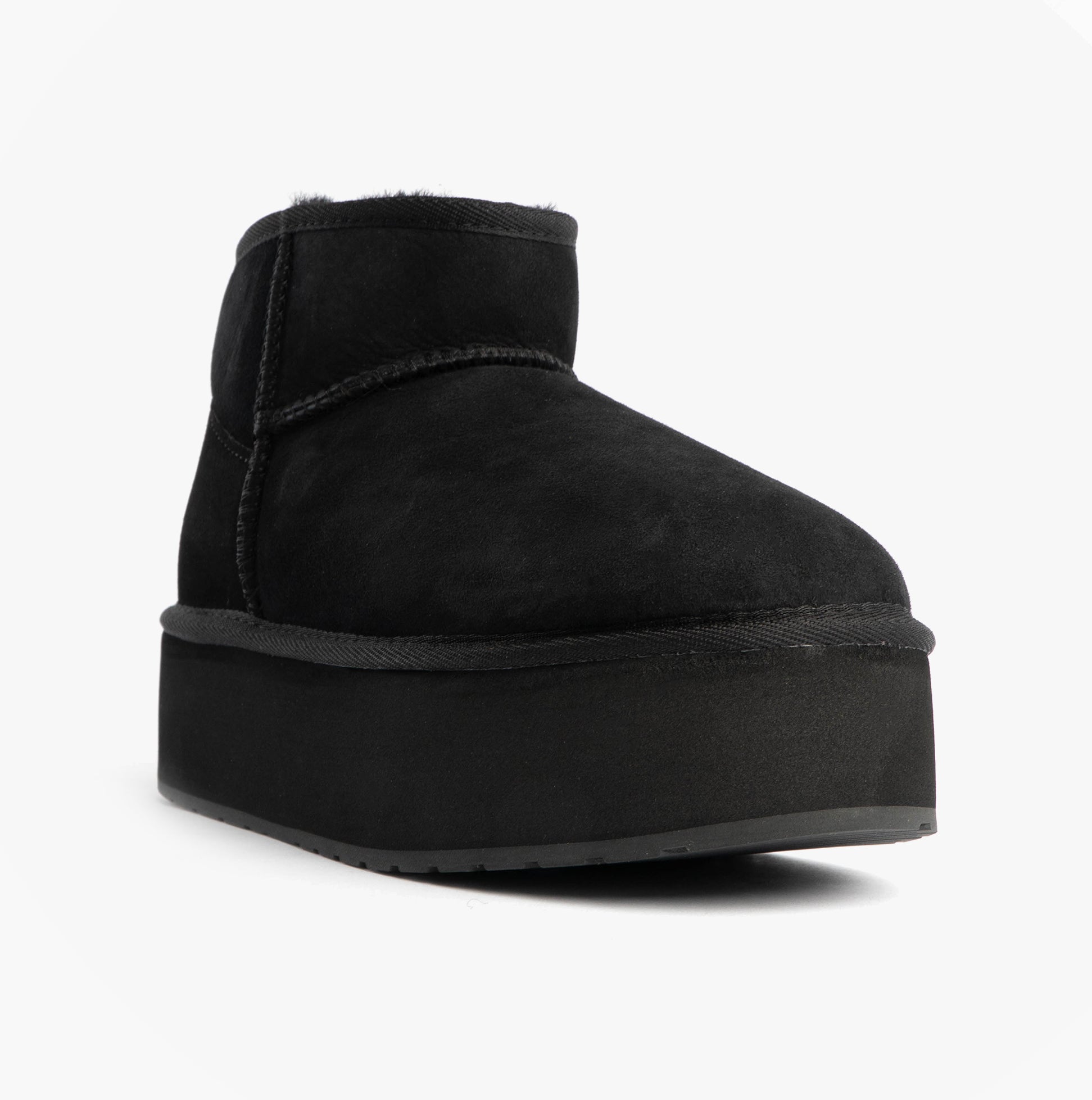 EMU Australia STINGER MICRO FLATFORM Womens Sheepskin Boot Black side view showing the shearling upper and platform sole