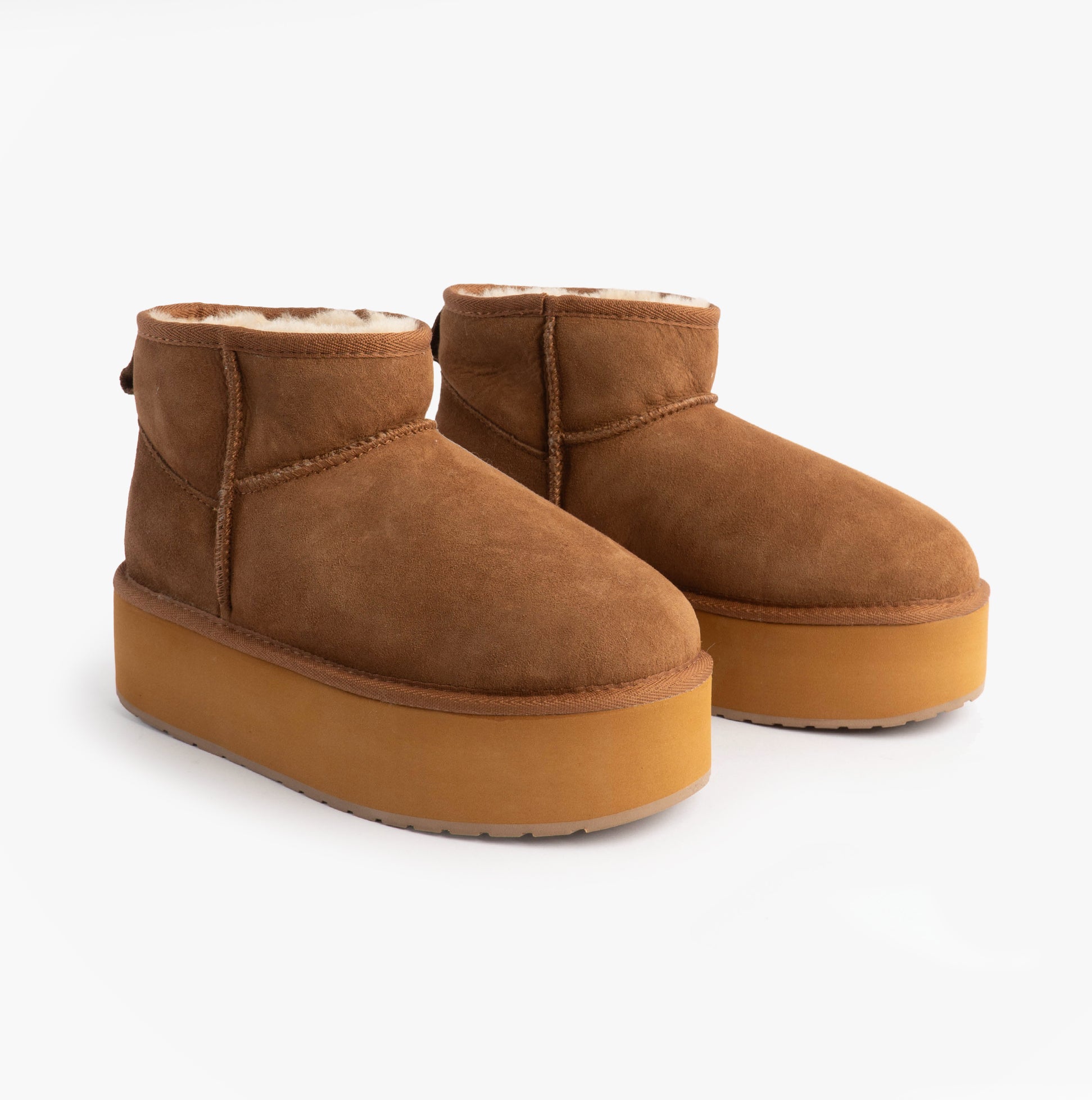 EMU Australia STINGER MICRO FLATFORM Womens Sheepskin Boot Chestnut side view showcasing plush sheepskin lining and rubber sole.