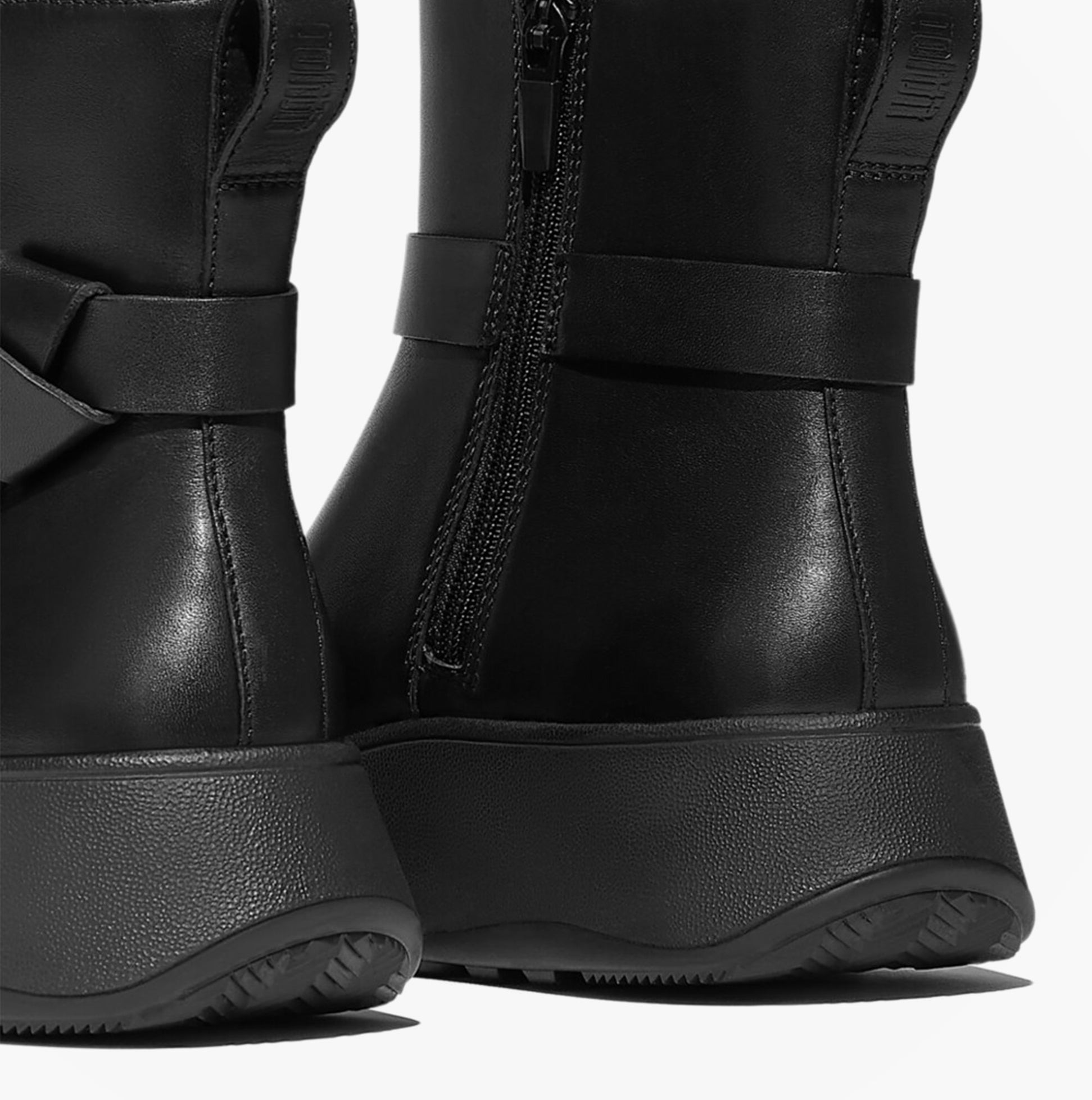 FitFlop F-MODE SQUARE-RING LEATHER FLATFORM Ladies Ankle Boots Black side view showcasing the smooth leather and zip detail.