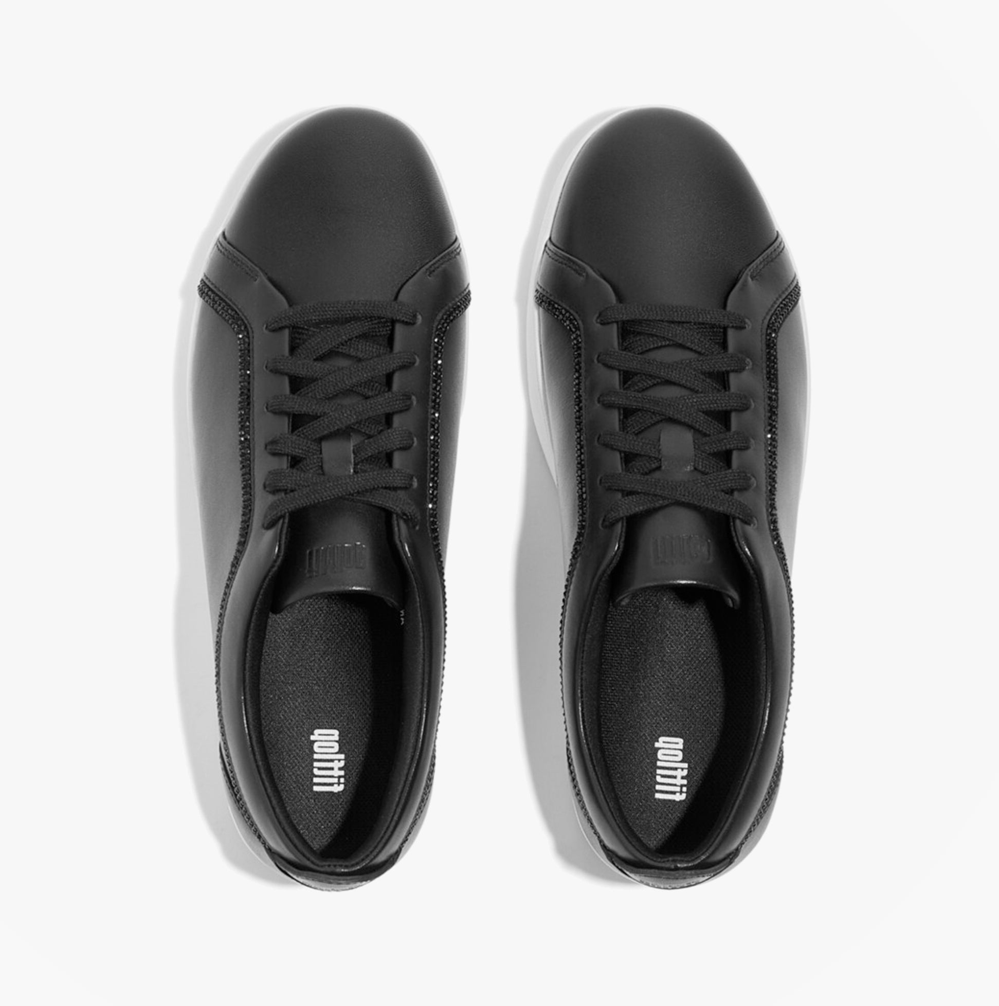 FitFlop RALLY CRYSTAL-TRIM LEATHER Womens Fashion Trainers Black top view with lace-up design and smooth leather finish.