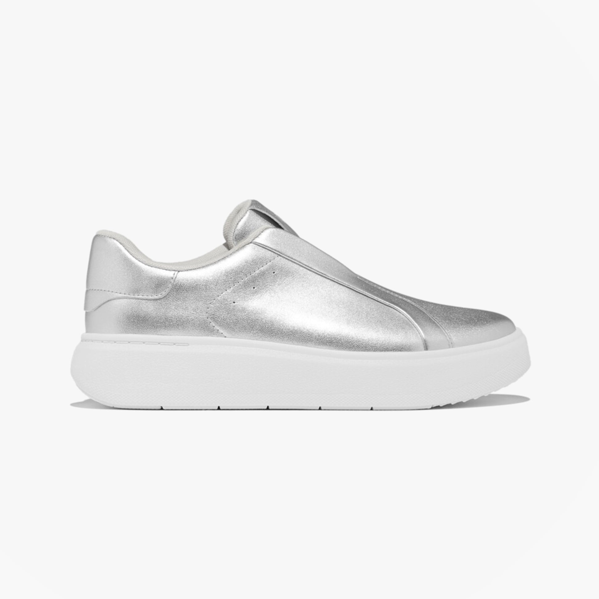 Side view of FitFlop 'Ready To Go' LEATHER LACELESS Ladies Sneakers Silver with a sleek metallic finish.