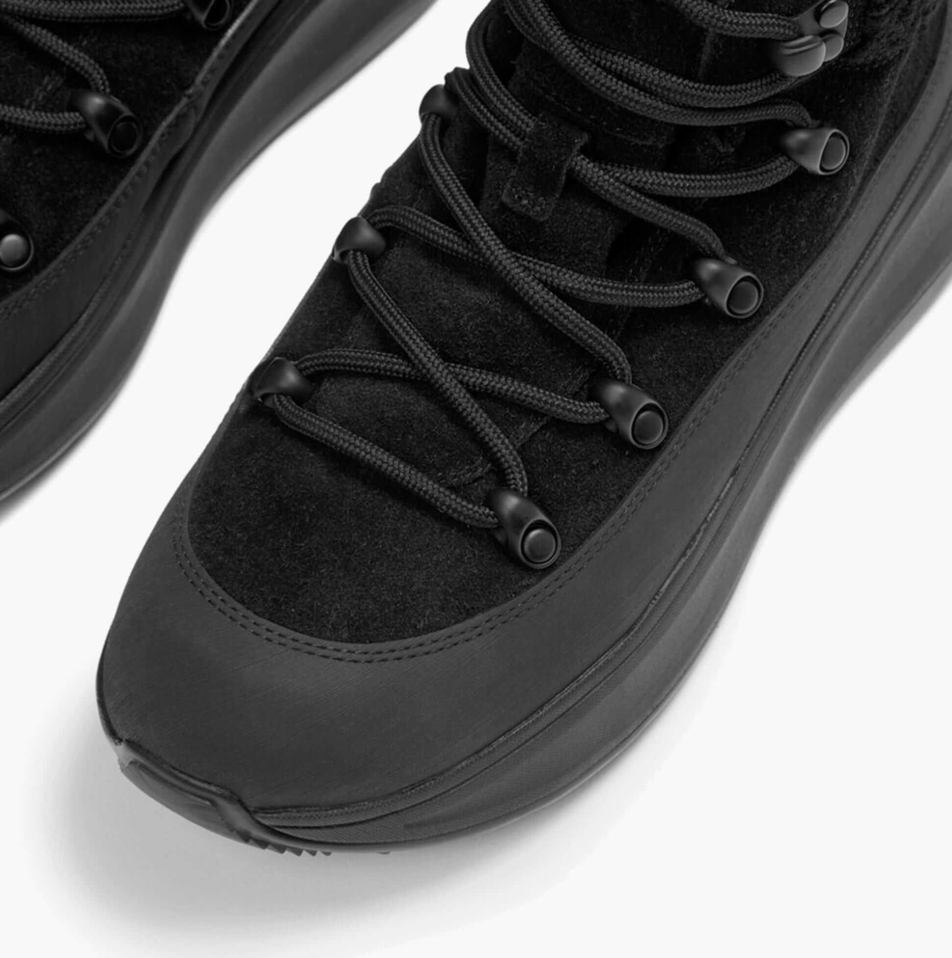 FitFlop F-MODE TEDDY-COLLAR WARM SUEDE Womens Suede Booties All Black detail view showcasing laces and suede material.