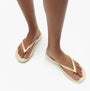 FitFlop IQUSHION Womens Flip Flops Gold side view, showcasing lightweight design and comfortable slip-on style.