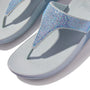 FitFlop LULU CRYSTAL EMBELLISHED Womens Toe Post Sandals Quiet Blue, detail view showcasing crystal embellishments on a light blue background.