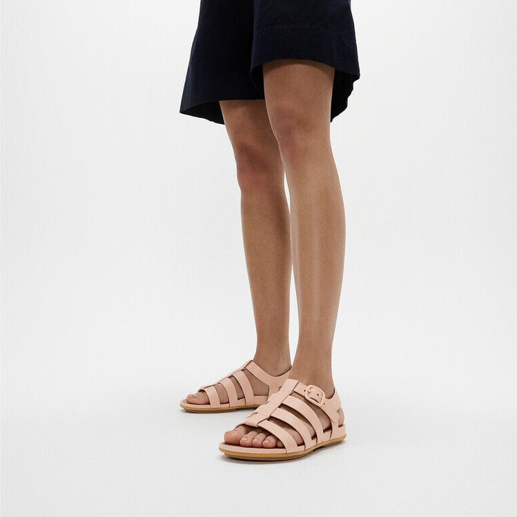 FitFlop GRACIE RUBBER-BUCKLE Womens Fisherman Sandals Sandy Beige side view on model's feet.