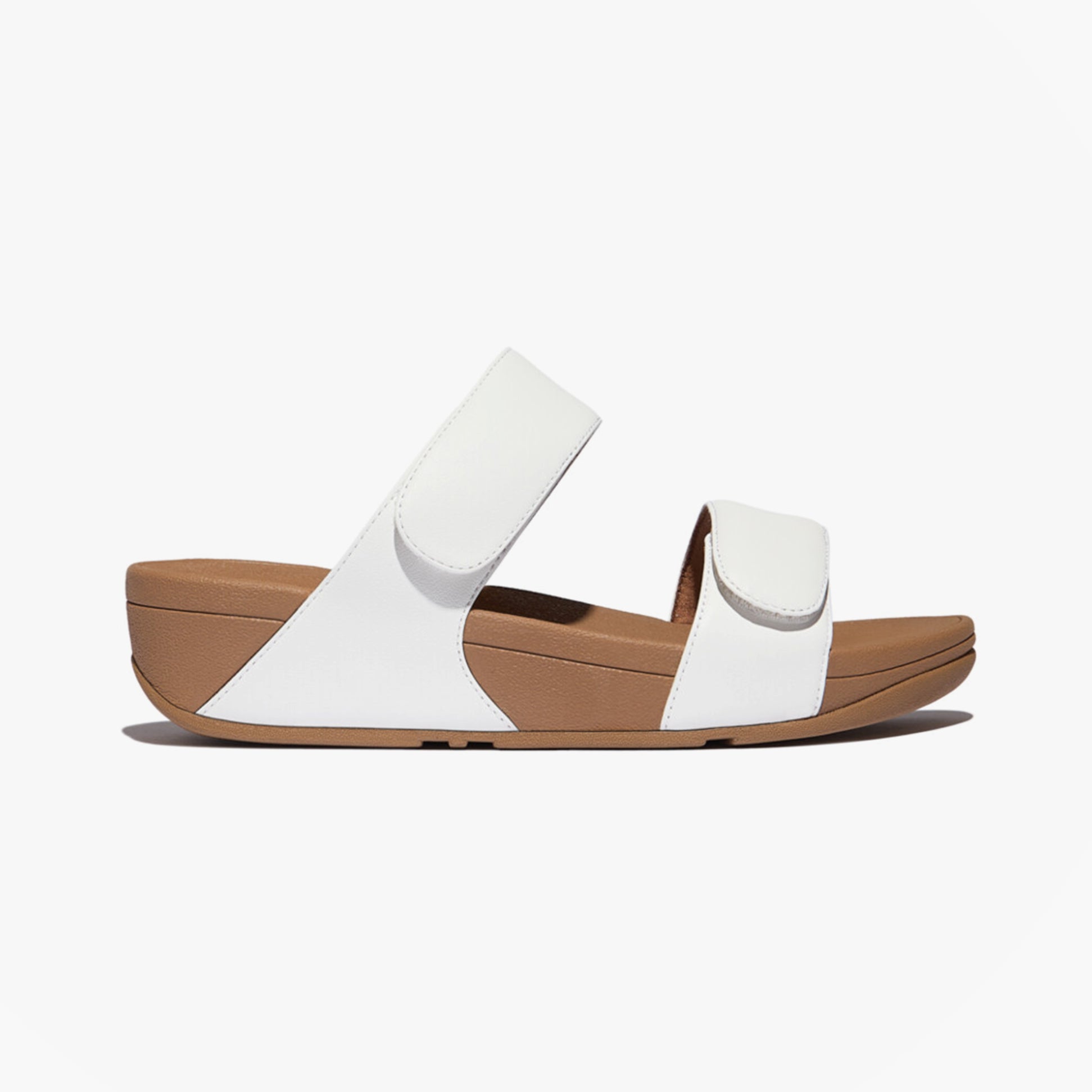 FitFlop LULU ADJUSTABLE Womens Slides Urban White side view with adjustable straps and rubber sole.