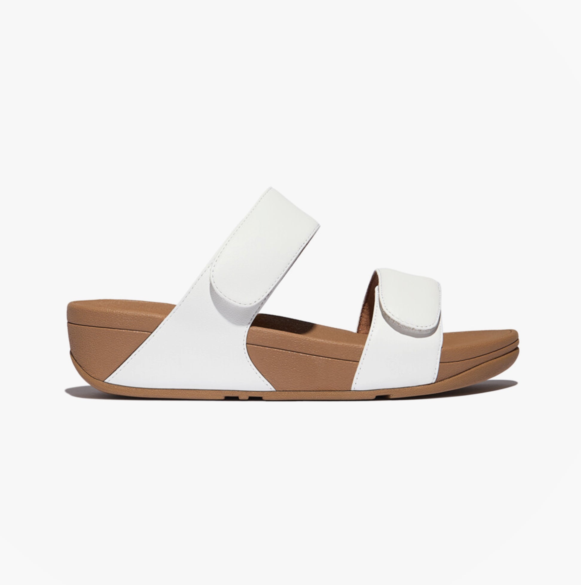 FitFlop LULU ADJUSTABLE Womens Slides Urban White side view with adjustable straps and rubber sole.