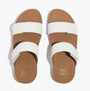 FitFlop LULU ADJUSTABLE Womens Slides Urban White top view showcasing dual white straps and brown sole.