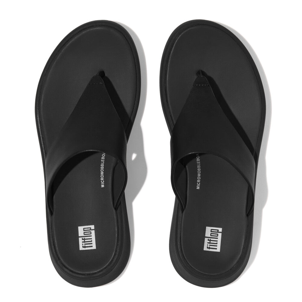 FitFlop F-MODE LEATHER FLATFORM Womens Toe Post Sandals All Black top view featuring sleek black leather and comfortable design.