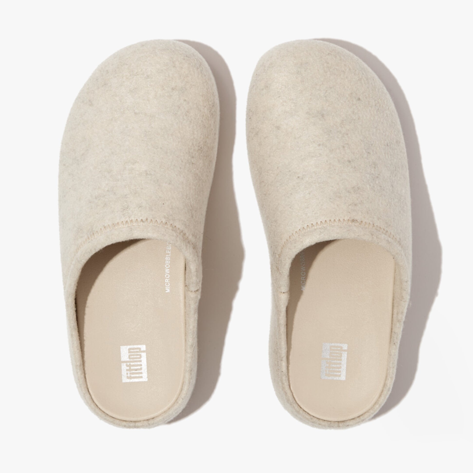 FitFlop SHUV e01 Womens Clog Slippers Ivory top view showcasing the felt upper and slip-on design.