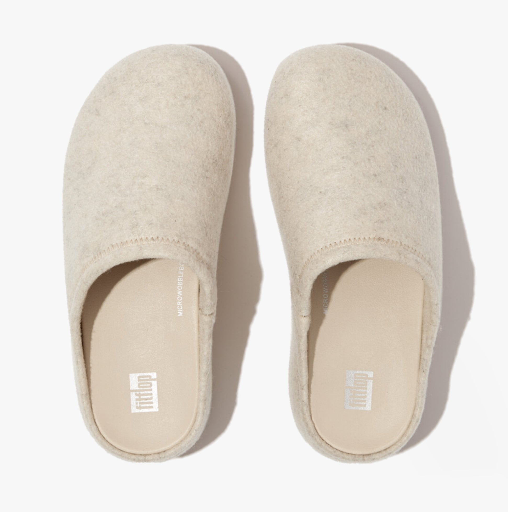 FitFlop SHUV e01 Womens Clog Slippers Ivory top view showcasing the felt upper and slip-on design.