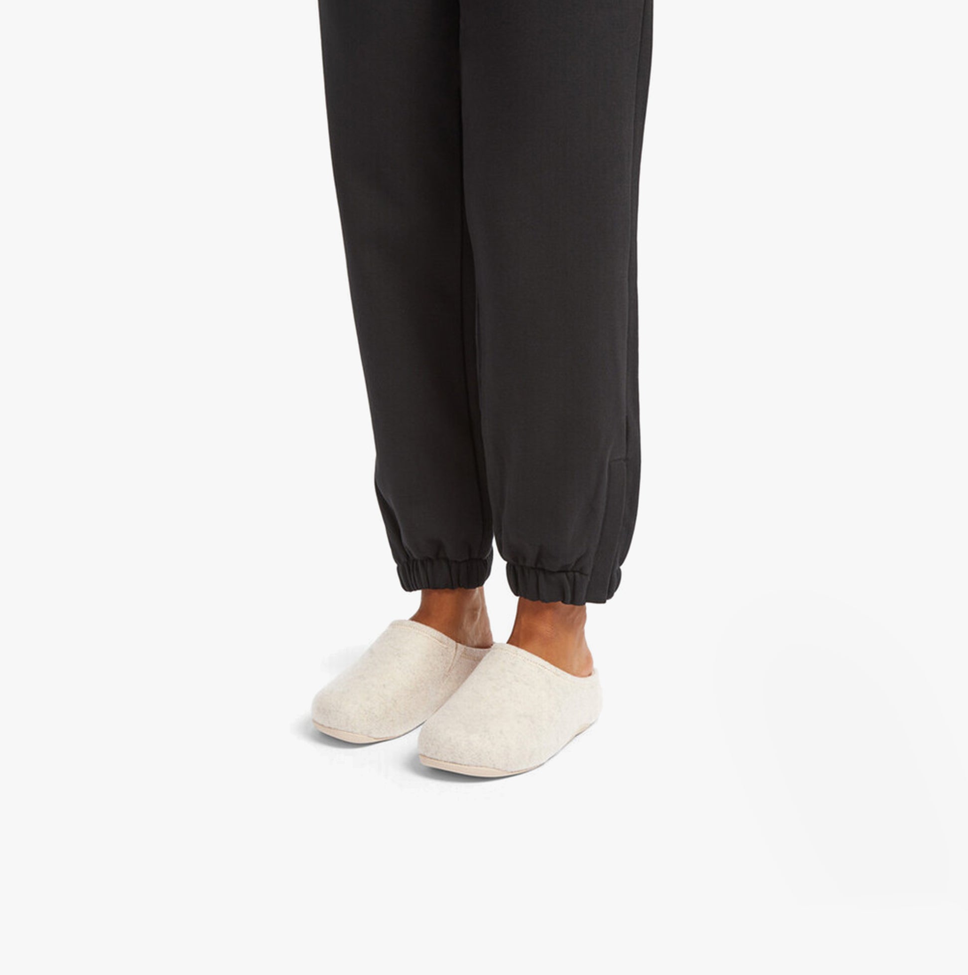 FitFlop SHUV e01 Womens Clog Slippers Ivory side view worn with black joggers