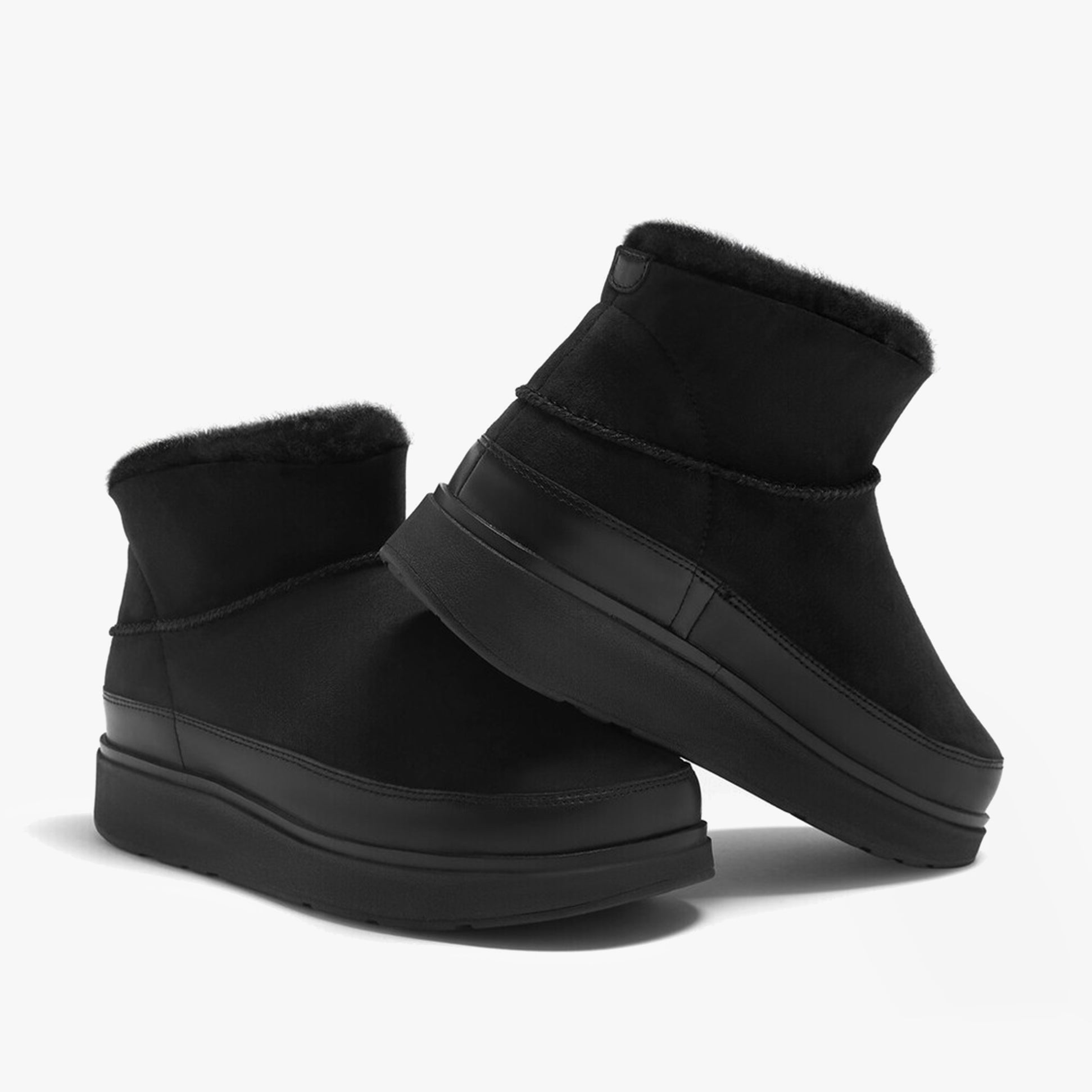 FitFlop GEN-FF ULTRA-MINI Womens Boots All Black side view showcasing shearling and rubber sole.