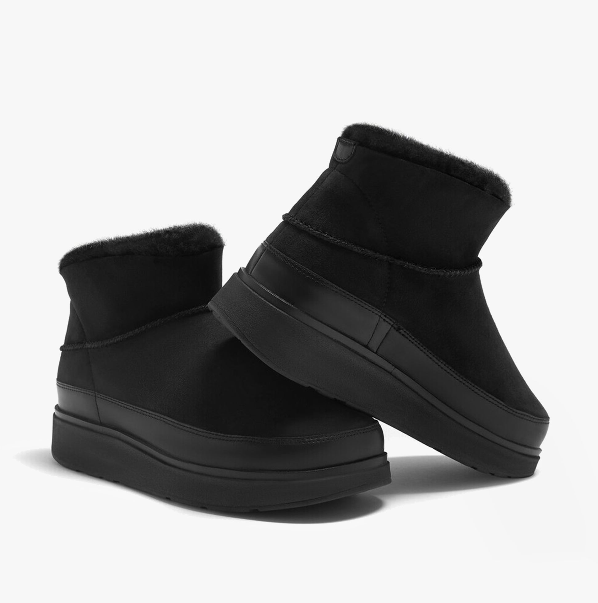 FitFlop GEN-FF ULTRA-MINI Womens Boots All Black side view showcasing shearling and rubber sole.