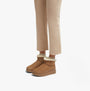 FitFlop GEN-FF ULTRA-MINI Womens Boots Desert Tan side view on model wearing beige pants.