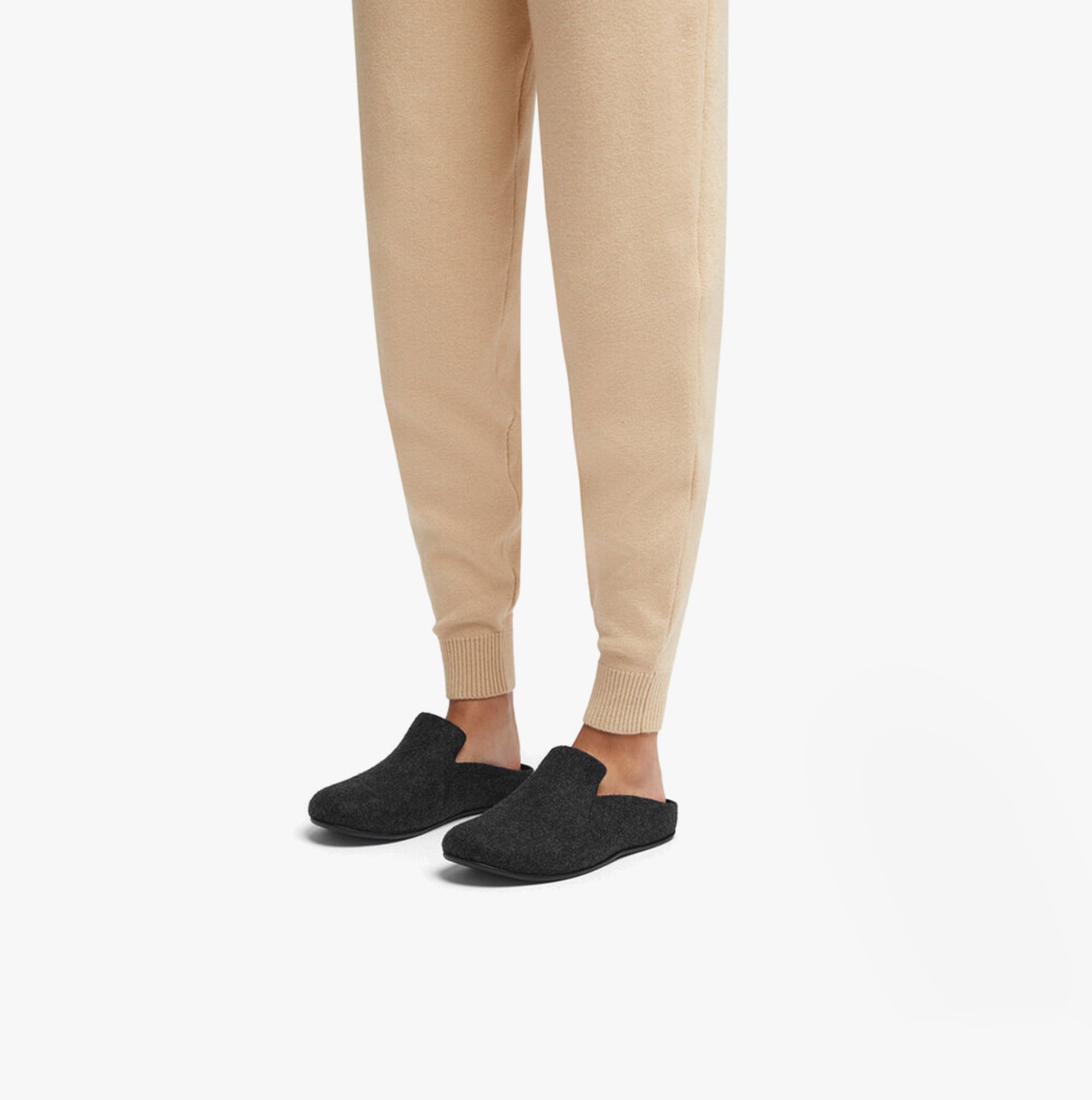 FitFlop CHRISSIE II HAUS E01 Womens Felt Slippers All Black side view worn with beige pants
