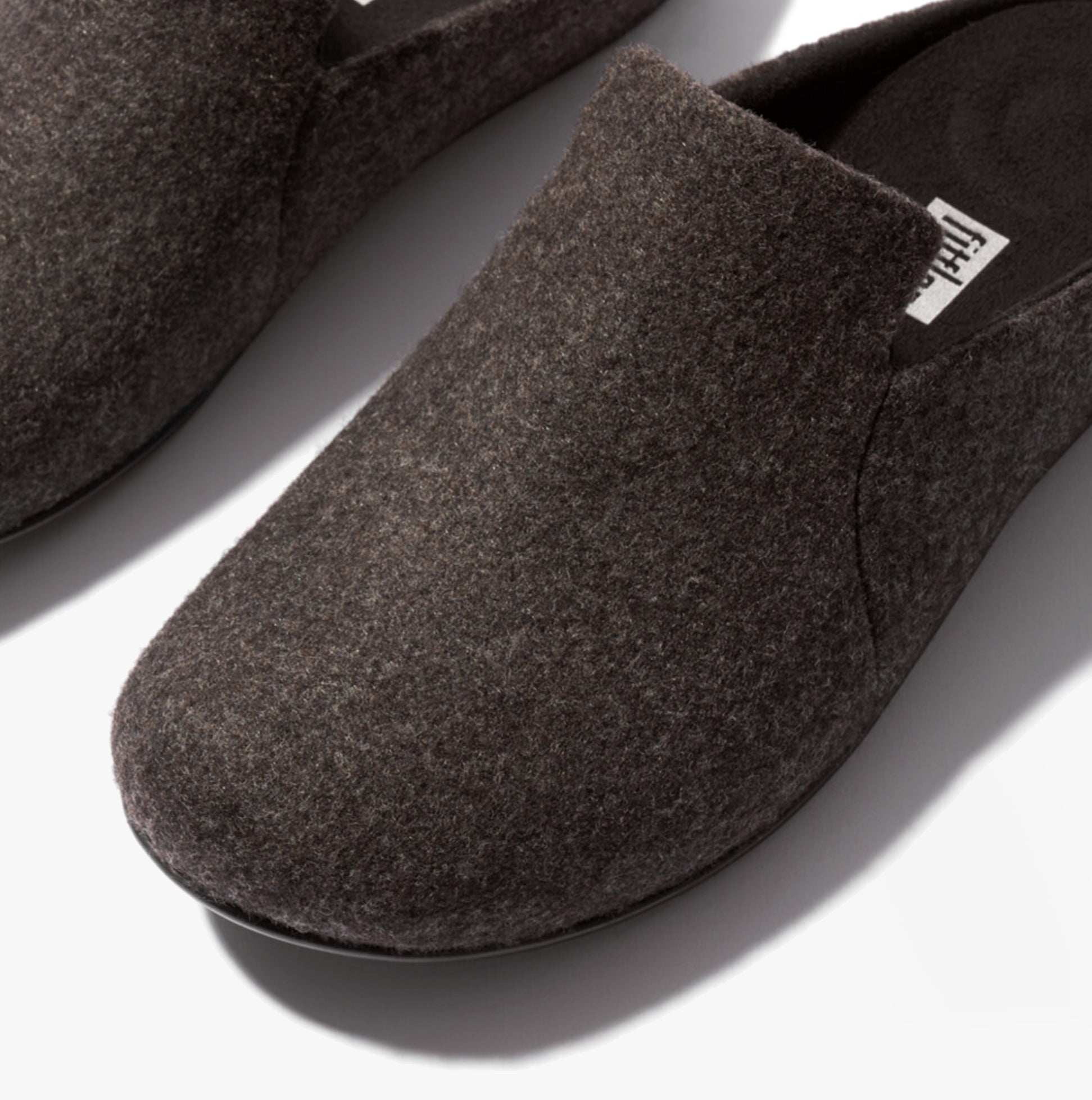 FitFlop CHRISSIE II HAUS E01 Womens Felt Slippers All Black close-up detail view of felt upper.
