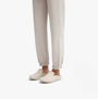 FitFlop CHRISSIE II HAUS E01 Womens Felt Slippers Ivory side view worn with beige joggers