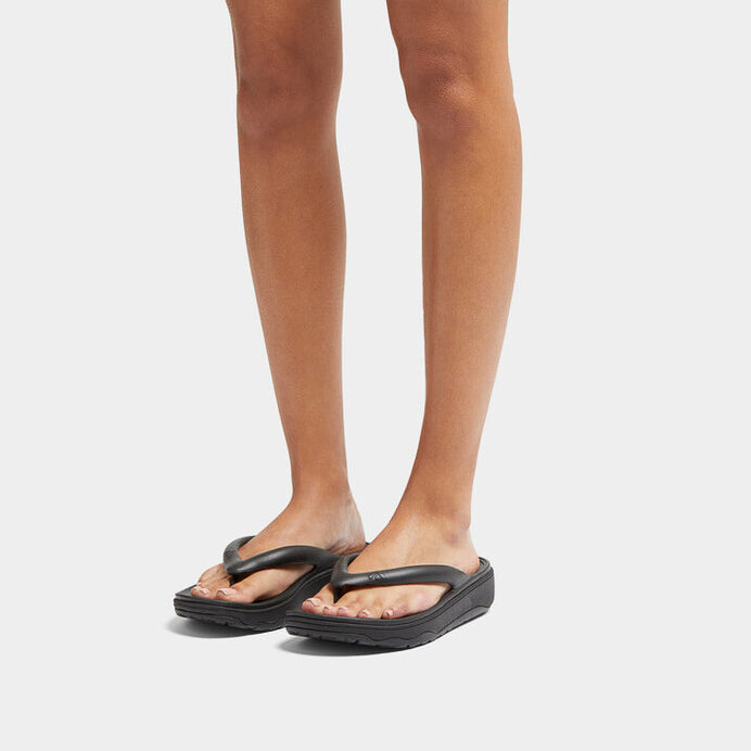 FitFlop RELIEFF RECOVERY Womens Toe Post Sandals Black, front view on model's feet, highlighting comfort and design.