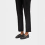 FitFlop ALLEGRO FRINGE BUCKLED Womens Loafers Black side view worn with black pants.
