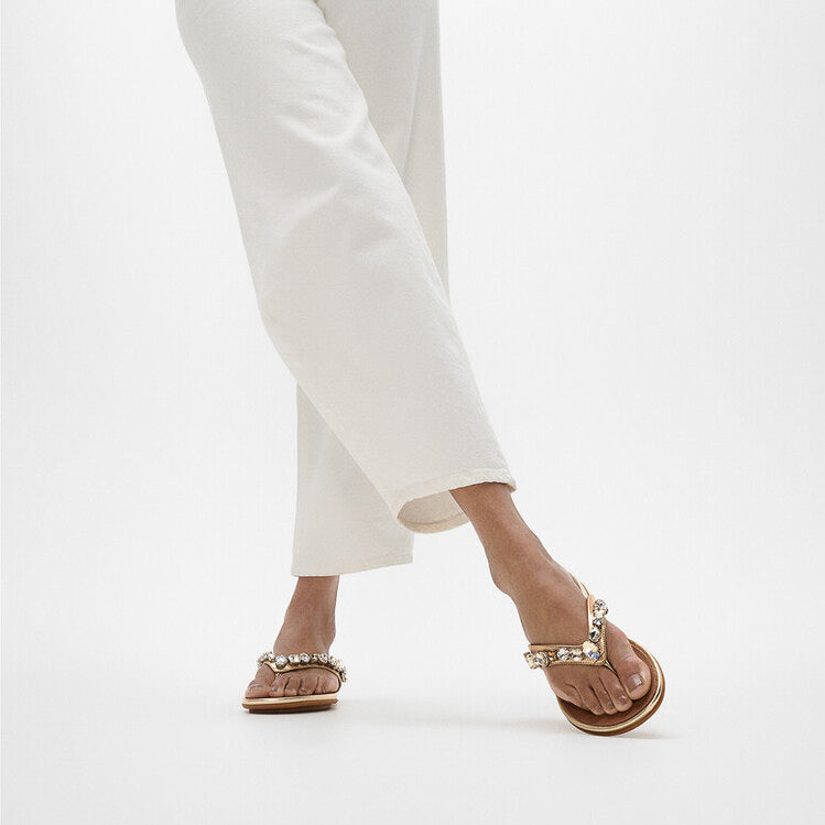 FitFlop GRACIE JEWEL-DELUXE Womens Flip Flops Silver side view worn with white pants