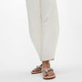 FitFlop GRACIE JEWEL-DELUXE Womens Flip Flops Silver worn by model in a casual outfit, showcasing side view with sparkling embellishments.