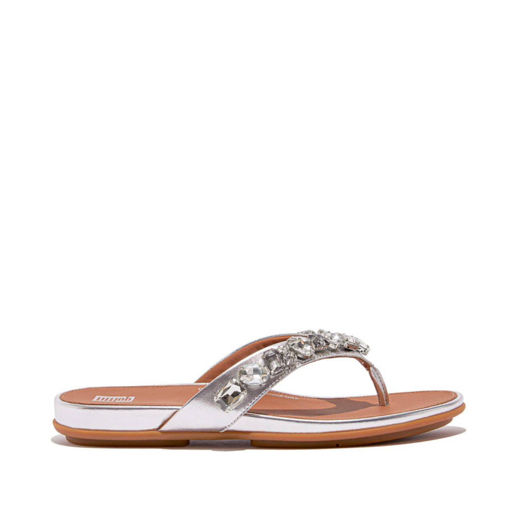 FitFlop GRACIE JEWEL-DELUXE Womens Flip Flops Silver side view with embellished strap and rubber sole.
