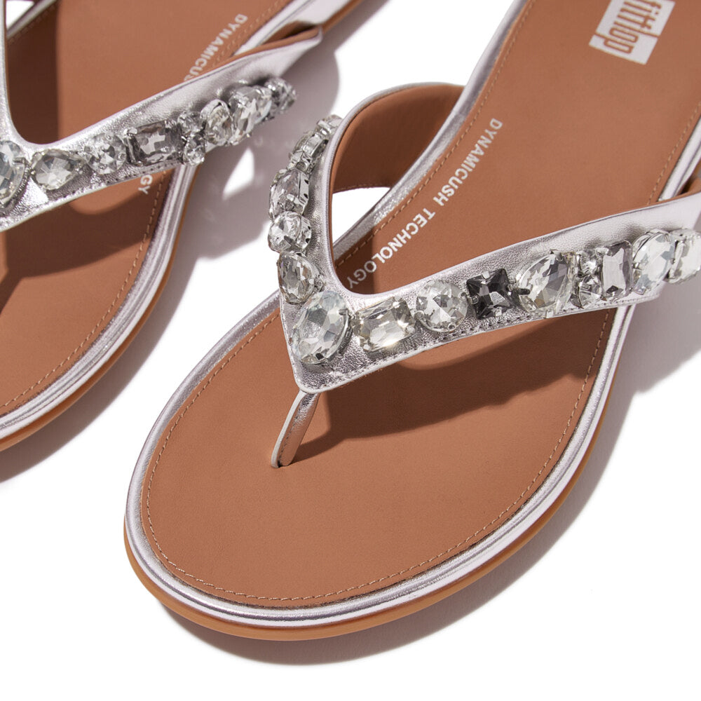 FitFlop GRACIE JEWEL-DELUXE Womens Flip Flops Silver detail view with jeweled strap and brown sole.