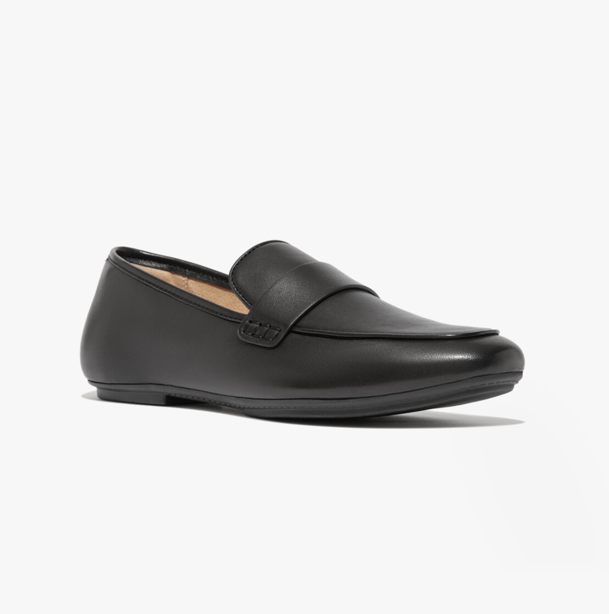 FitFlop DELICATO SOFT Womens Loafers Black side view showing leather upper and slip-on design.