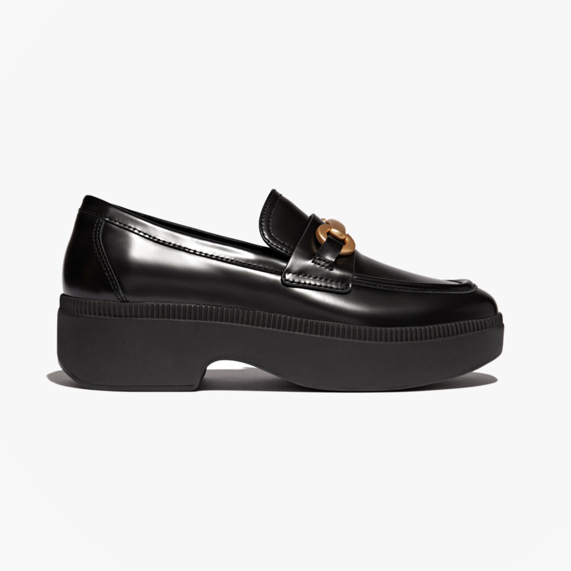 FitFlop F-LUMA CHUNKY SNAFFLE Womens Wedge Loafers Black side view showcasing sleek leather upper and chunky sole.